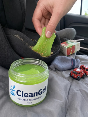 Customer photo: green CleanGel lifting crumbs out of a child car seat