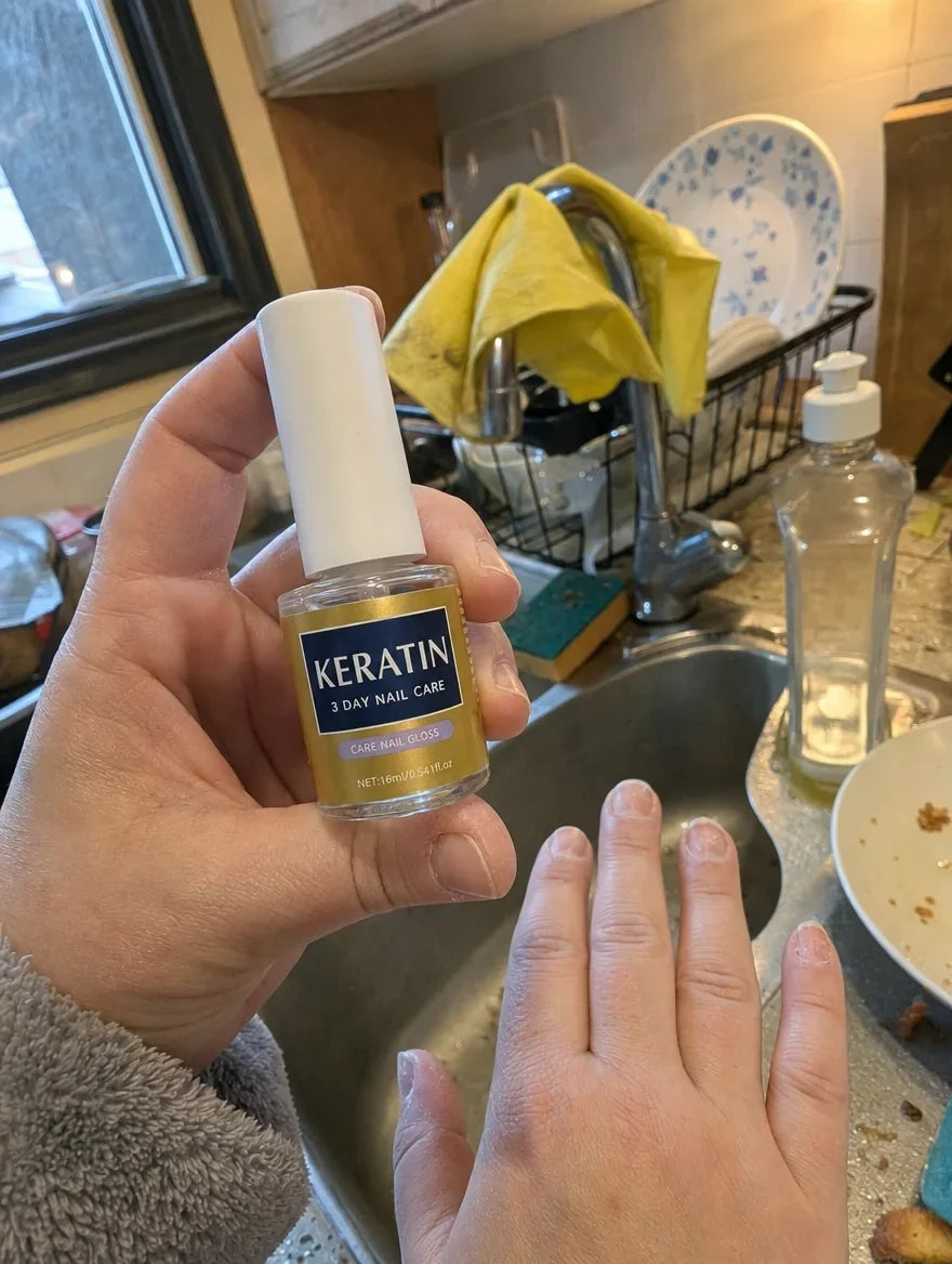 Customer photo: VitaNails bottle held in front of a kitchen sink after doing the dishes
