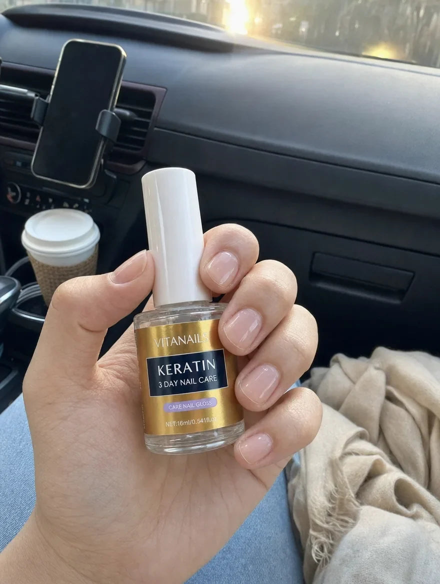 Customer photo: VitaNails bottle held in a car, short natural glossy nails